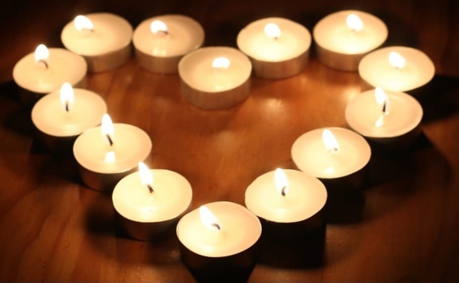 informal service with candle lighting for baby loss awareness 