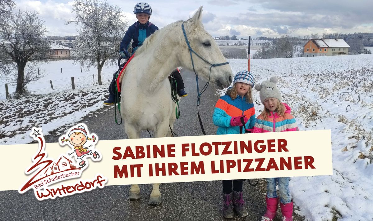 Sabine Flotzinger mit Ihrem Lipizzaner beim Winterdorf