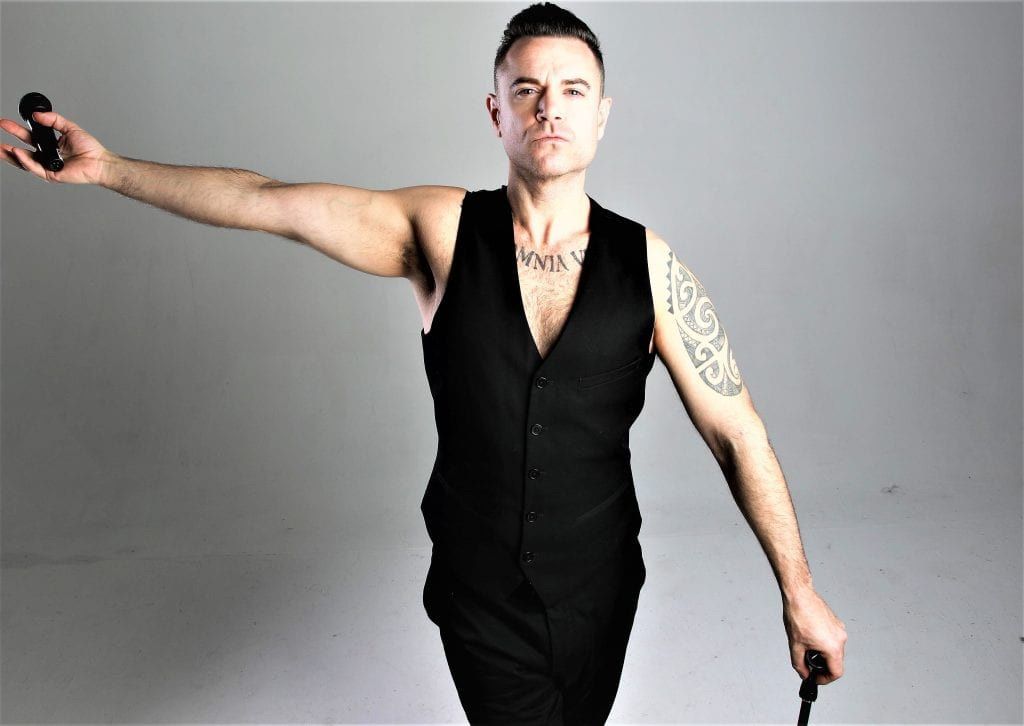 Scott Borley as Robbie Williams