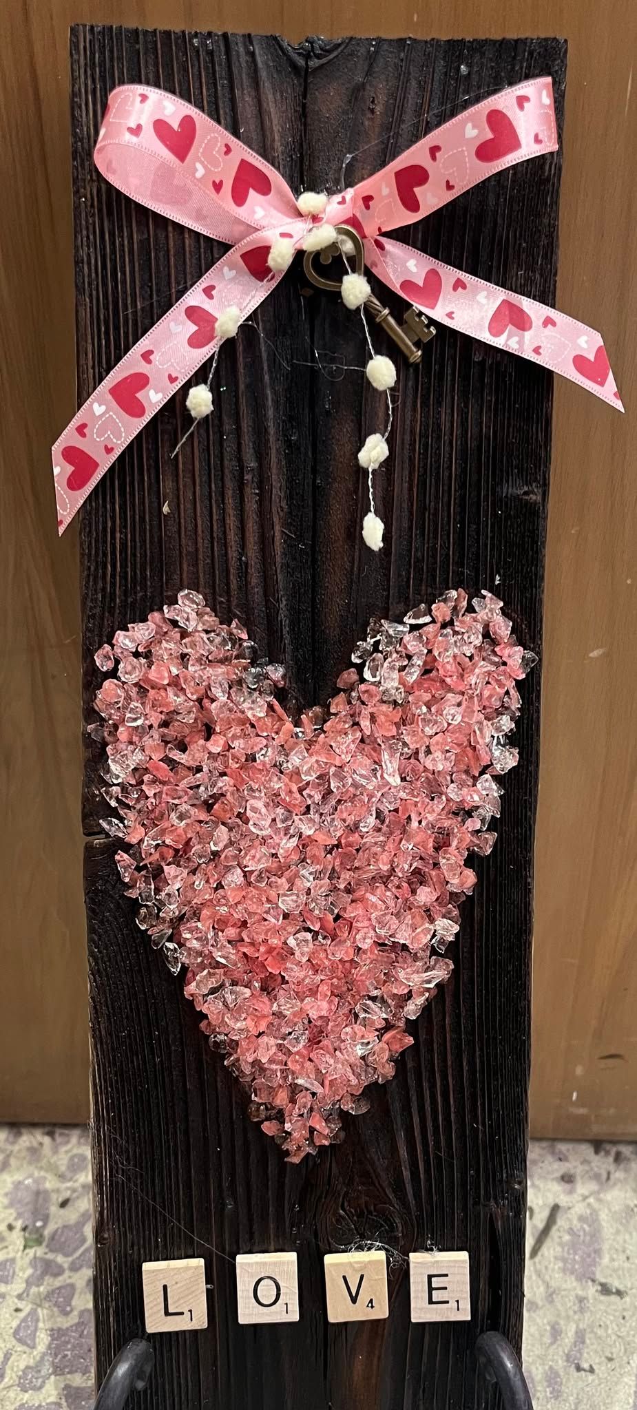 Crushed glass heart class on wood