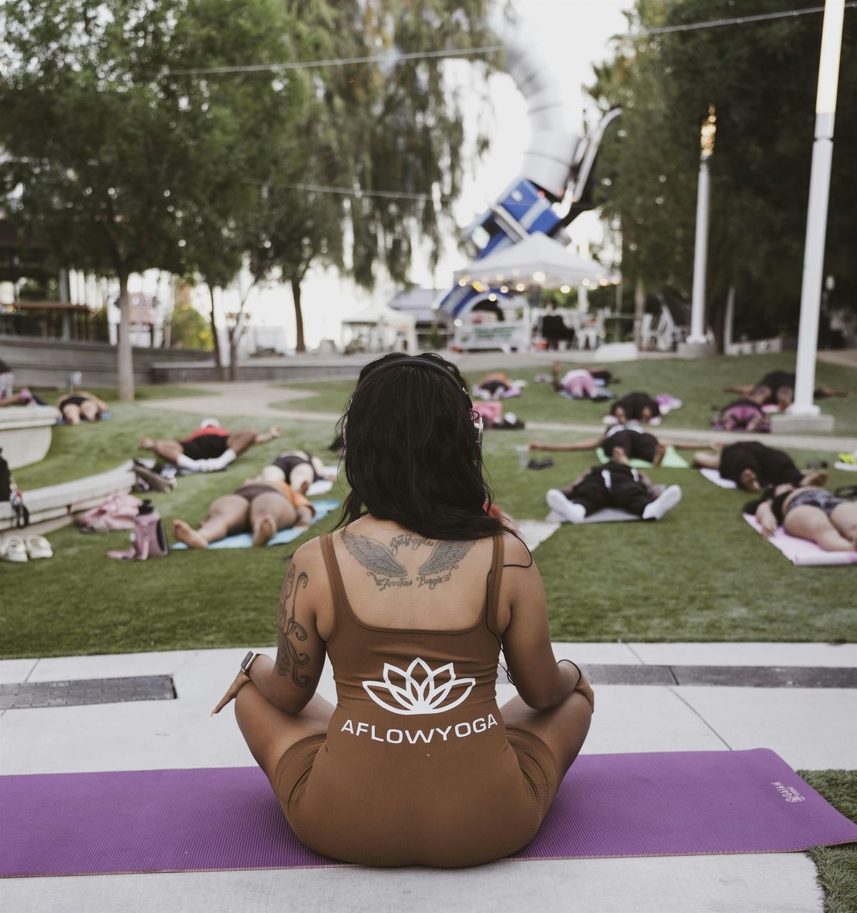 Silent headphone yoga at Sunset