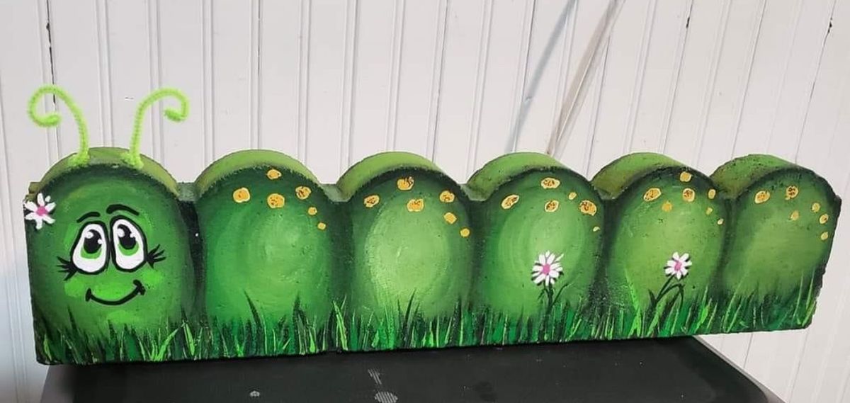Caterpillar yard art 