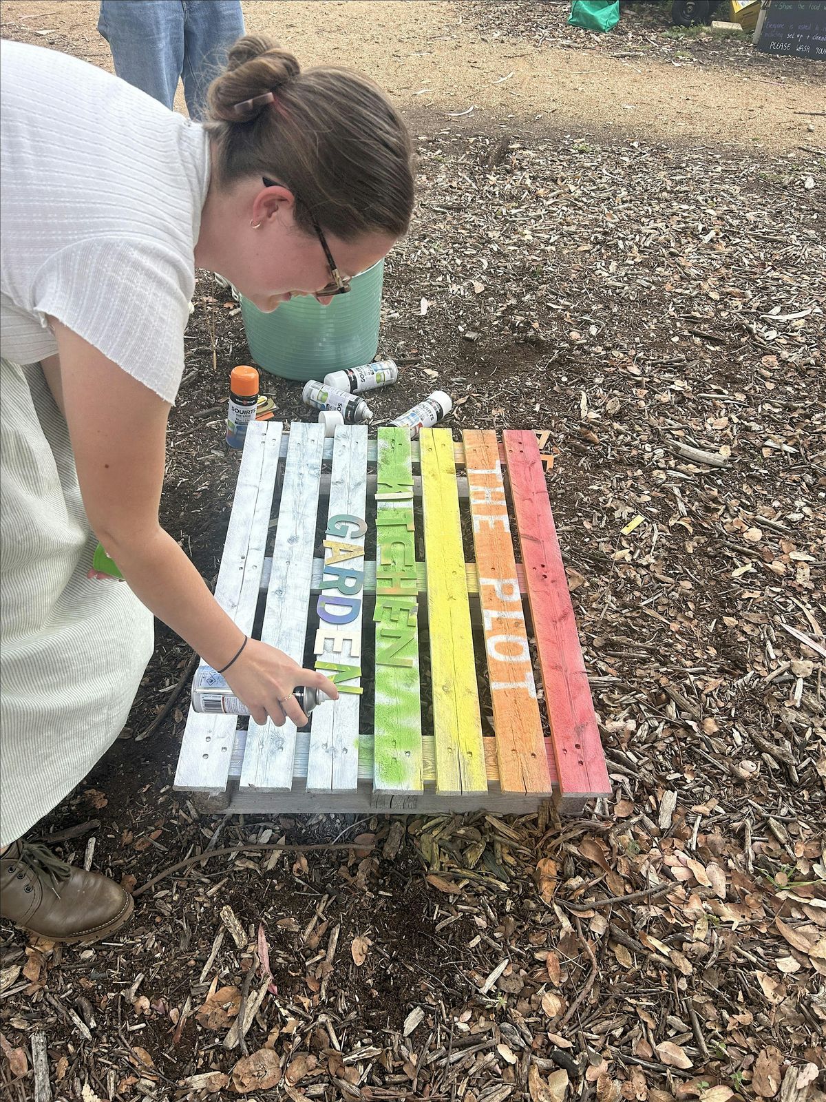 Painting decorations and signs for The Kitchen Garden Plot