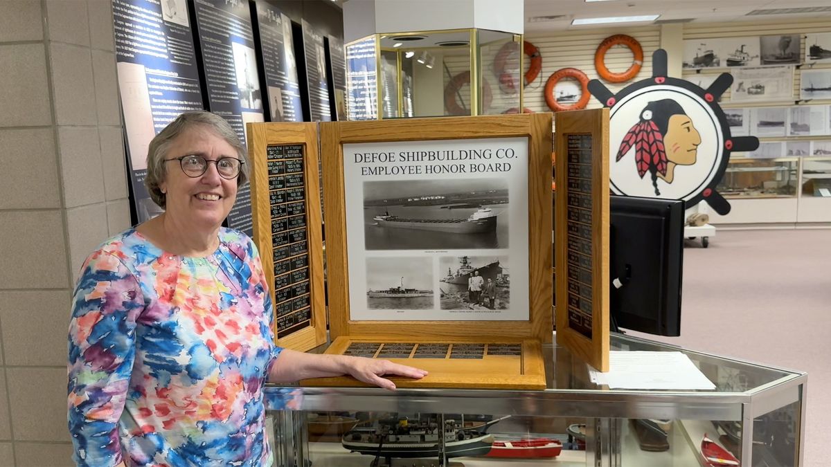 Helen DeFoe with "A Family History of the Defoe Shipbuilding Company"