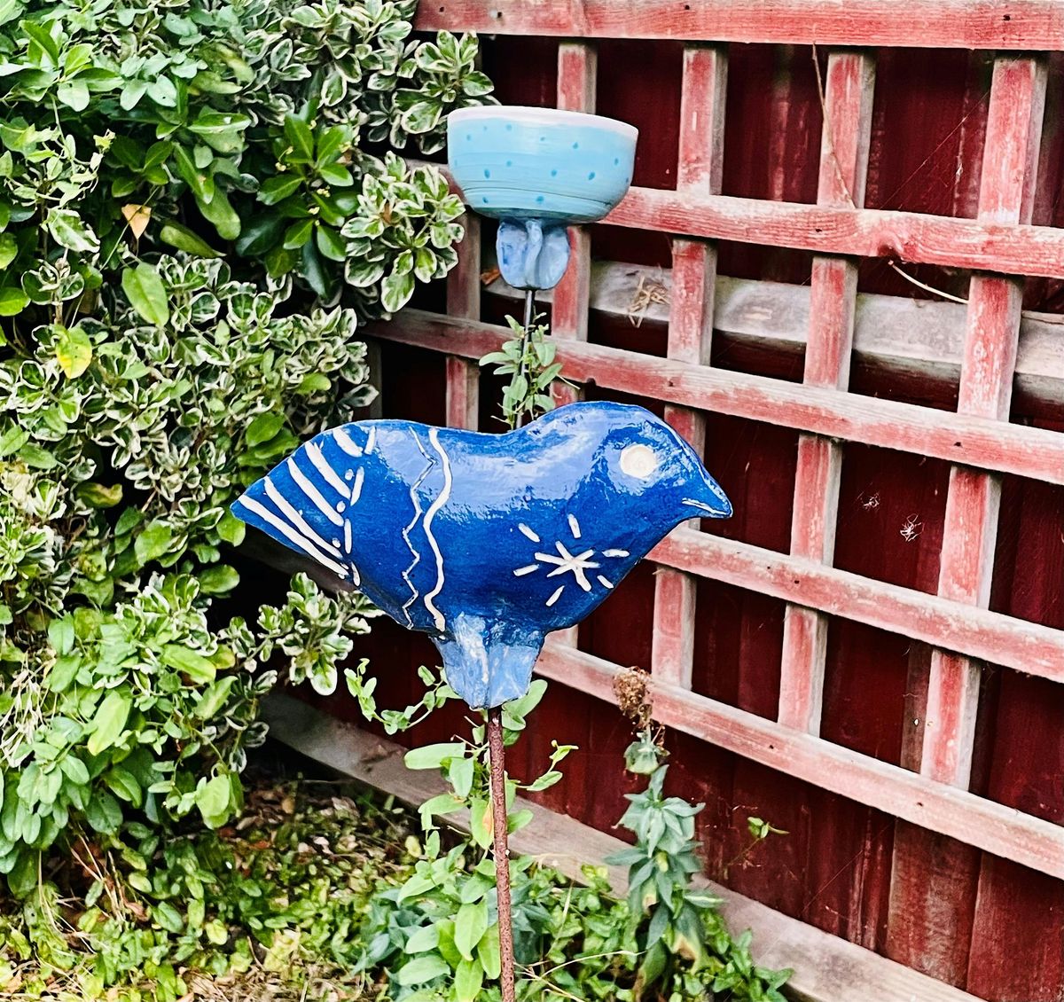 Pottery bird garden sculpture