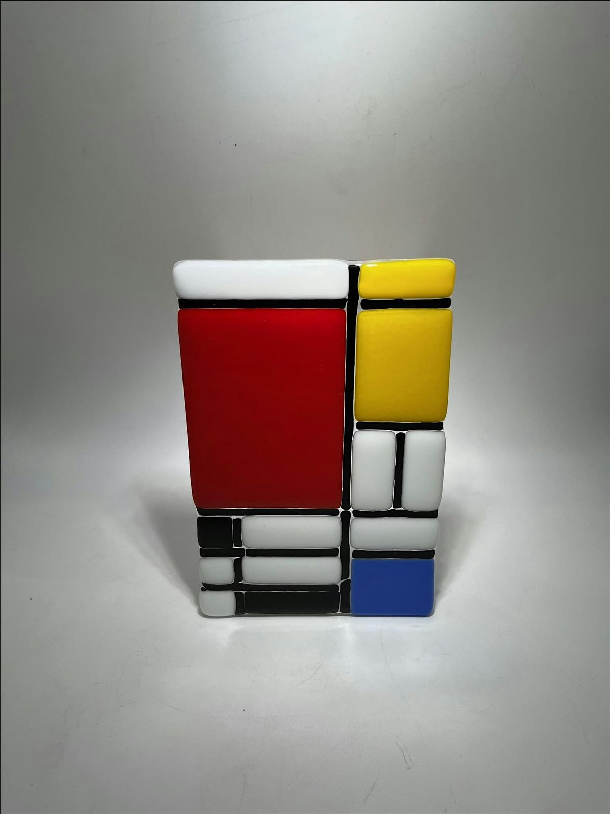 Be a Piet Mondrian-Design like an artist; plan, cut, edge, glue, slump.