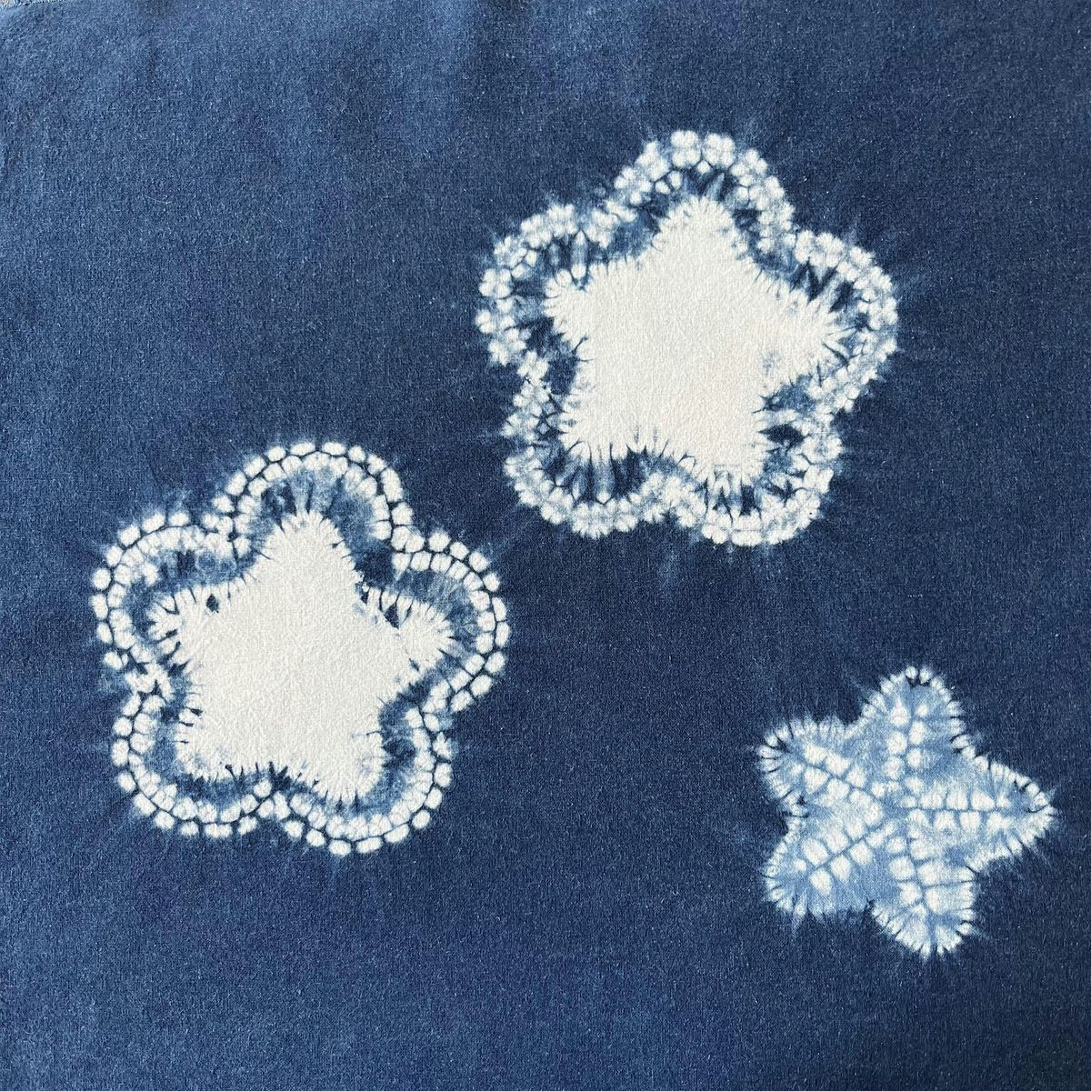 Studio based Boshi shibori capping and reserved grounds with indigo dyeing