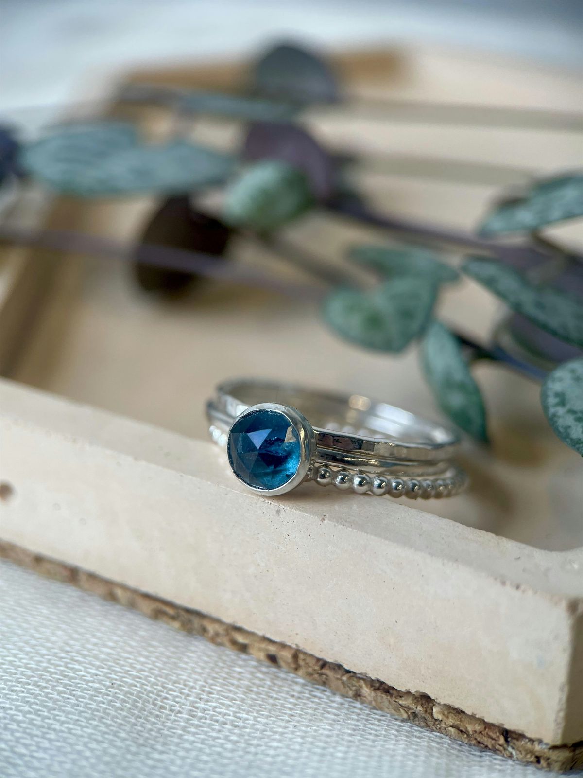 Stacking gemstone and sterling silver rings.