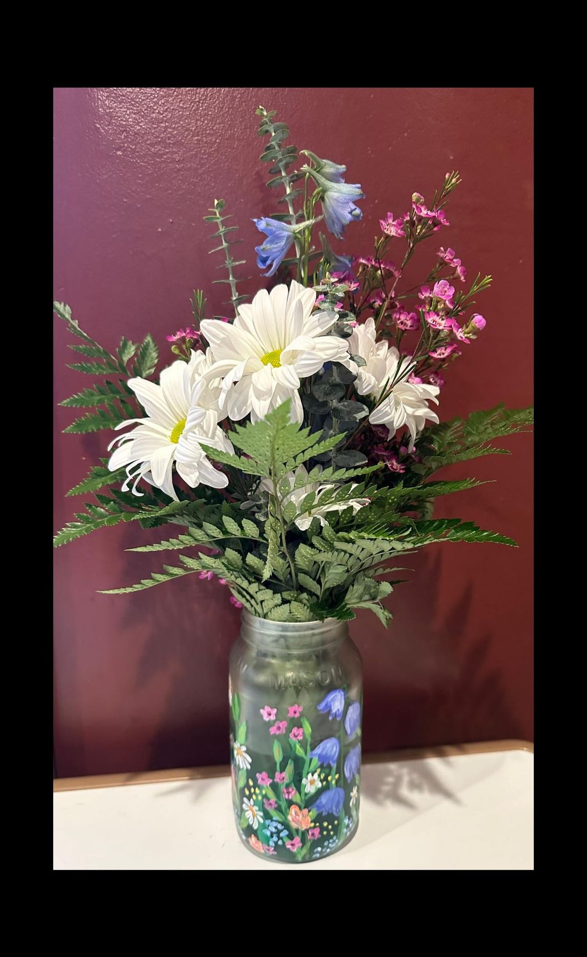 Mason Jar painting with flower arrangement