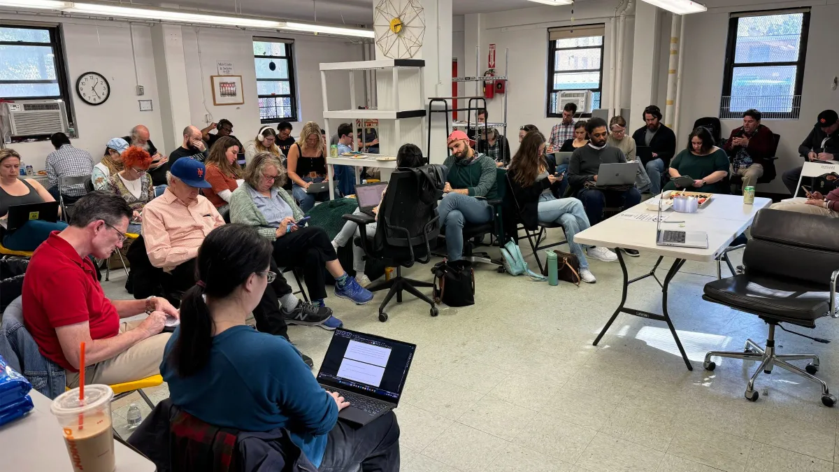 Writing group meeting at a huge\/unusual space in Alphabet City