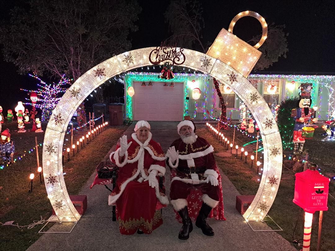 Santa and Mrs. Claus plus light display